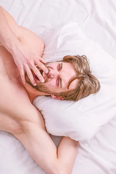 Bearded man sleeping face relaxing on pillow. Man handsome guy lay in bed. Expert tips on sleeping better. Get adequate and consistent amount of sleep every night. How much sleep you actually need