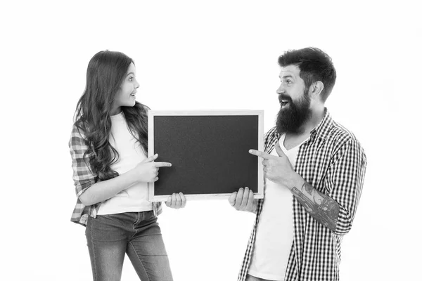 Children day. Happy family. Bearded man father with daughter. Little girl love her father. Childrens happiness. Little girl pointing on blackboard. Father and daughter hold empty board. copy space — Stock Photo, Image