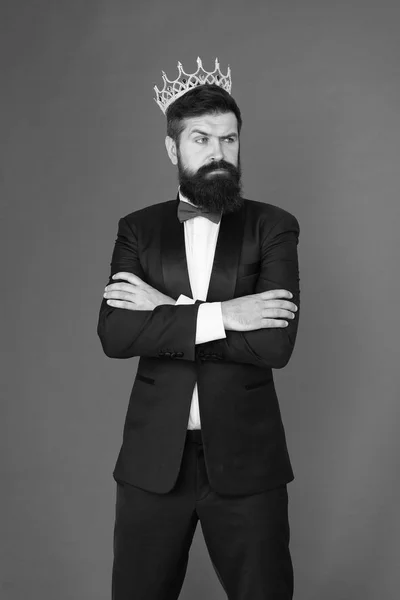 King of style. Man groom in wedding suit. Big boss style. Formal event. King crown. Bearded man in tuxedo and bow tie. Egoist. Businessman in tuxedo and king crown. Formal wear male fashion style