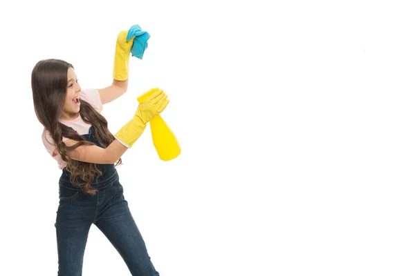 Mist sprayer helpful for wiping dust. Girl yellow rubber protective gloves ready for cleaning copy space. Household duties. Girl cute kid cleaning around. Protect sensitive skin. Kid cleaning at home — Stock Photo, Image