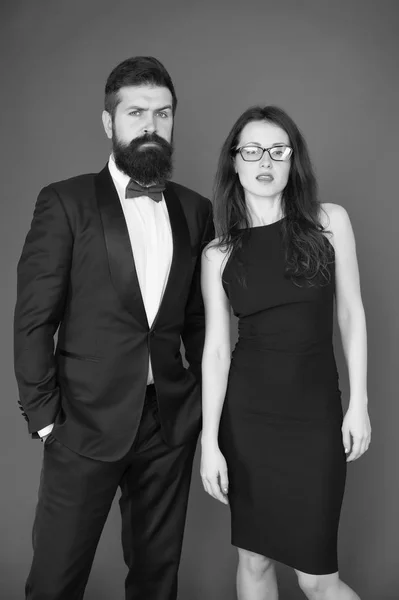 Formal dress code. Official event concept. Man bearded wear tuxedo girl elegant dress. Visiting event or ceremony. Couple classy clothes. Elite event. Main rules picking clothes. Corporate party