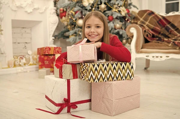 Child enjoy the holiday. Fill our Christmas with joy and cheer. The morning before Xmas. Little girl. Christmas tree and presents. Happy new year. Winter. xmas online shopping. Family holiday — Stock Photo, Image