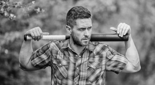 Bully guy in nature with cudgel. Wild energy. Power and strength. Feel my strength. Man unshaven strict face hold black baseball bat. Strong temper. Principle concept. Confident in his strength — Stock Photo, Image
