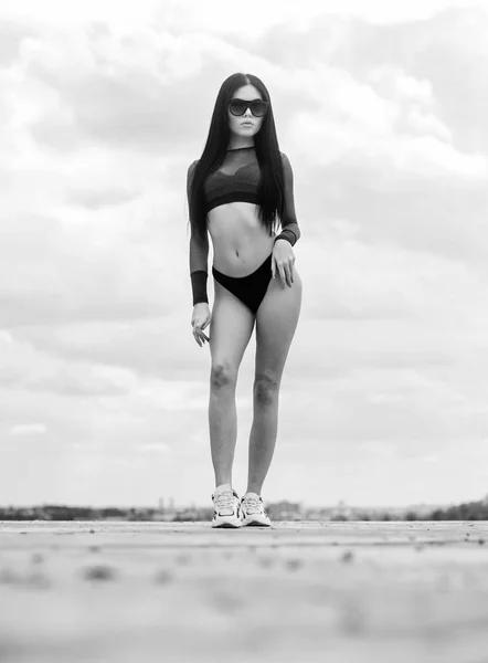 six pack. sport and fitness. Sky. freedom. sensual girl in underwear and sunglasses outdoor. perfect body with no cellulite and fat. sexy woman with fit body. summer fashion beauty. six pack concept