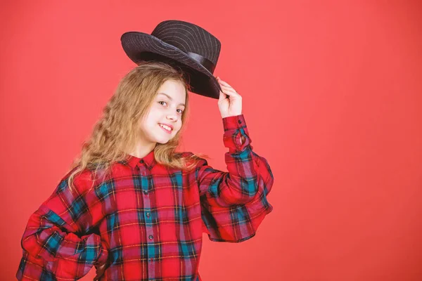 Fashion trend. Feeling awesome in this hat. Girl cute kid wear fashionable hat. Small fashionista. Cool cutie fashionable outfit. Happy childhood. Kids fashion concept. Check out my fashion style