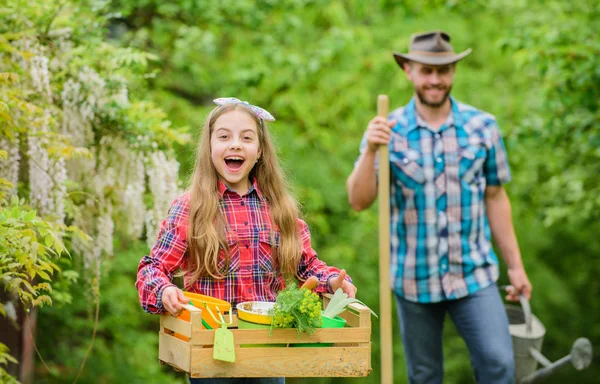 Flowers need good care. ecology. Gardening tools. little girl and happy man dad. earth day. spring village country. family farm. father and daughter on ranch. Nature needs your care — Stock Photo, Image