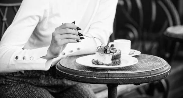 Piece of cake with red berry. Gourmet recipe food. Cake slice on white plate. Cake with cream delicious dessert. Appetite concept. Dessert cake cup of coffee and female hand with fork close up — Stock Photo, Image