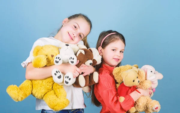 Happy childhood. handmade. sewing and diy crafts. playground in kindergarten. toy shop. childrens day. small girls with soft bear toys. little sisters girls playing game in playroom. Playing together — Stock Photo, Image