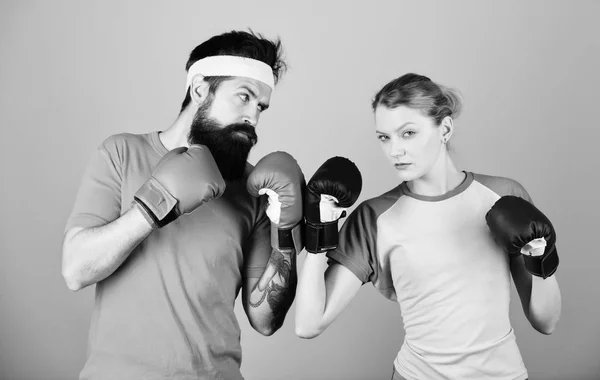 Be careful. Boxing sport concept. Couple girl and hipster practicing boxing. Sport for everyone. Amateur boxing club. Equal possibilities. Strength and power. Man and woman in boxing gloves — Stock Photo, Image