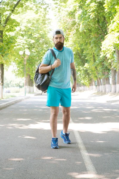 Id rather be backpacking. Bearded man goes backpacking on summer vacation. Hipster hiker in casual style taking backpack in backpacking trip. Wilderness backpacking is the outdoor recreation