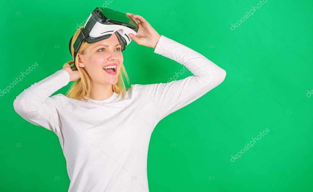 Woman with virtual reality headset. Woman watching virtual reality vision. Beautiful woman wearing virtual reality goggles in studio. Outline game.