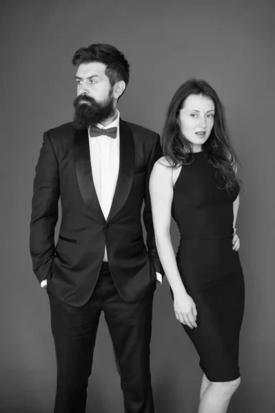 All black dress code. Official event concept. Man bearded wear tuxedo girl elegant dress. Visiting event or ceremony. Couple classy clothes. Elite event. Main rules picking clothes. Corporate party