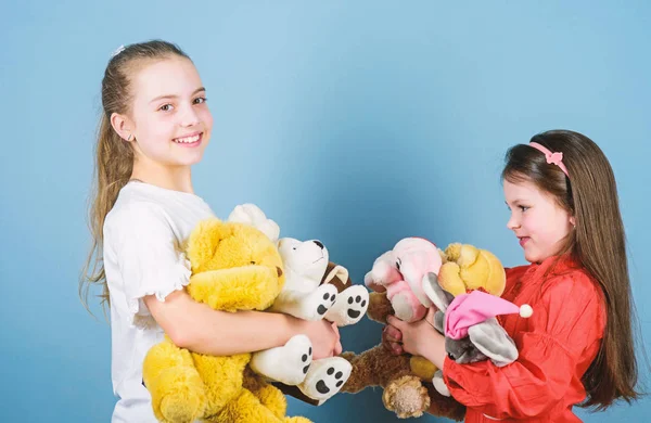 Family is the most important thing. small girls with soft bear toys. toy shop. childrens day. playground. little sisters girls playing game in playroom. happy childhood. handmade. sewing diy crafts — Stock Photo, Image