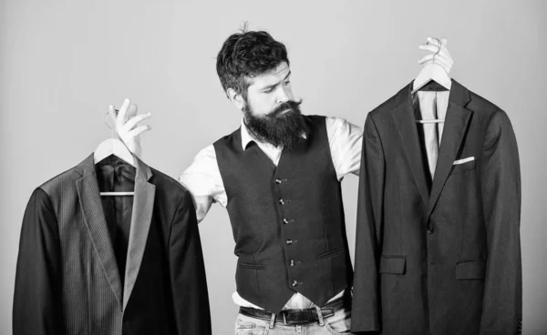 Designing made to measure suit. Custom made suit. Man bearded fashion couturier tailor. Elegant custom outfit. Tailoring and clothes design. Perfect fit. Custom made to measure. Tailored suit concept