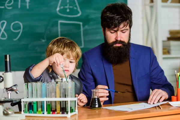 Biotechnology research concept. Wisdom. Back to school. Formula. experiments in organic chemistry laboratory. small boy with teacher man. son and father at school. Education teaches us way of living — Stock Photo, Image