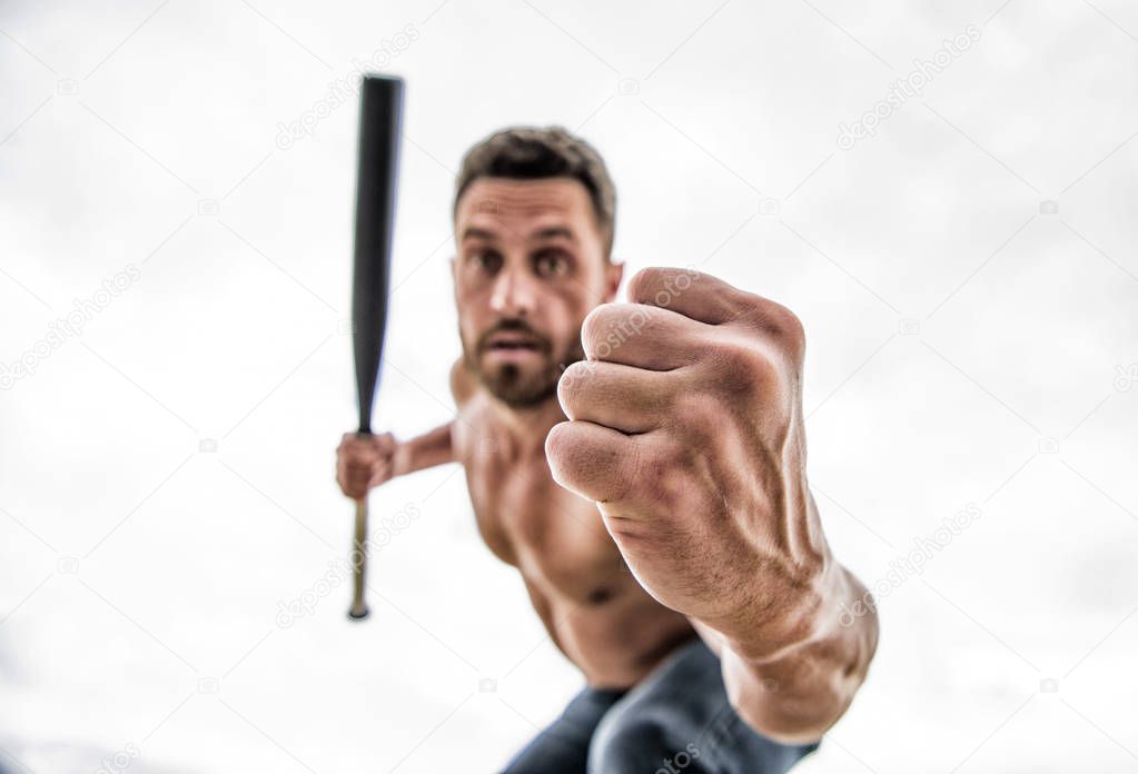 Ready to fight. see my fist. man with baseball bat. i am a criminal. Hooligan man hits the bat. Bandit gang and conflict. aggression and anger. unshaven muscular man fighting. full of energy