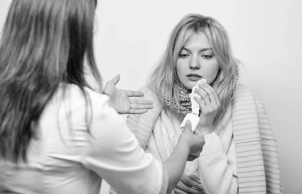 It will help her to breathe. Doctor visiting unhealthy woman at home. Medical doctor examining patient. Primary care doctor making diagnosis to sick woman. Patient care and healthcare