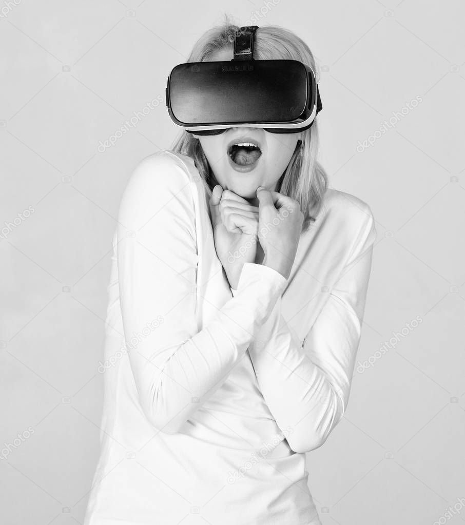 Woman using VR device. The woman with glasses of virtual reality. Funny young woman with VR. Woman using virtual reality.