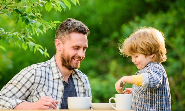 organic and natural food. small boy child with dad. healthy food. Family day bonding. father and son eat outdoor. they love eating together. Weekend breakfast. Family day. Family traditions