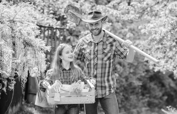 Family dad and daughter little girl planting plants. Day at farm. Planting flowers. Plant veggies. Planting season. Popular in garden care. Inspect your garden daily to spot insect trouble early — Stock Photo, Image