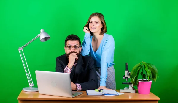 love affair at work. Seduction. businessman and assistant solve problem. woman and man work in office at laptop. business couple at computer. secretary with boss at workplace. Business conference