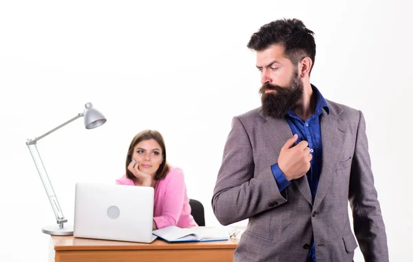 Hipster businessman. Hipster with long beard in formal wear. Confident hipster and coworker in office. Bearded hipster with pretty woman working in background — Stock Photo, Image