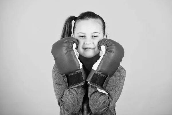 Boxer child in boxing gloves. Female boxer. Sport upbringing. Boxing provide strict discipline. Girl cute boxer on blue background. With great power comes great responsibility. Contrary to stereotype — Stock Photo, Image