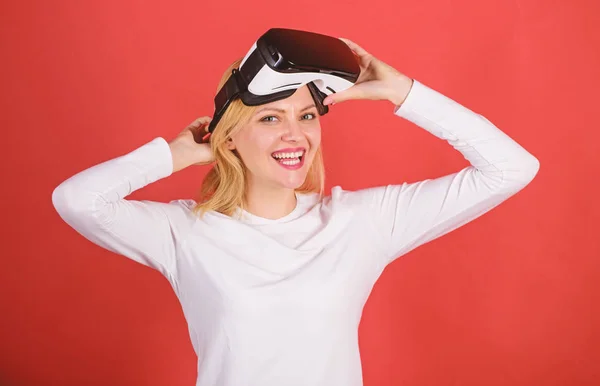 Woman excited using 3d goggles. The woman with glasses of virtual reality. Excited smiling businesswoman wearing virtual reality glasses. VR in hands.
