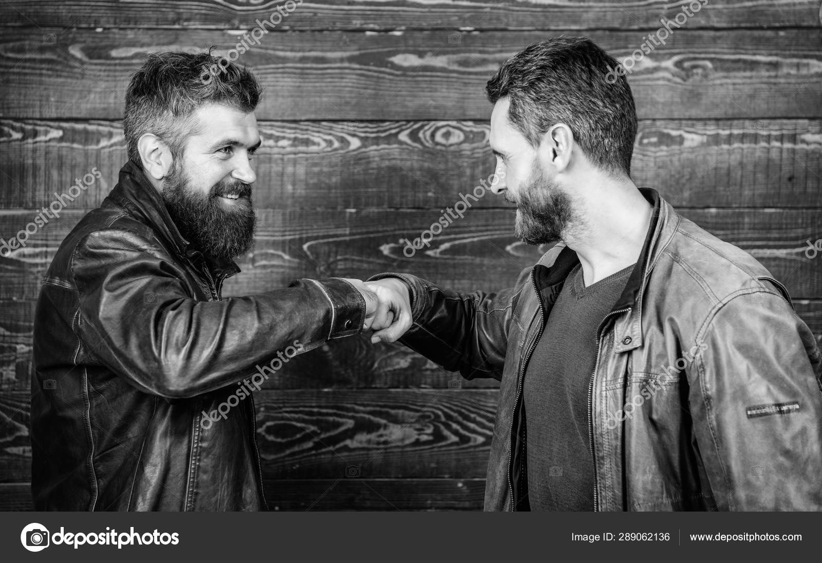 Brutal Bearded Men Wear Leather Jackets Shaking Hands Strong Handshake brutal-bearded-men-wear-leather-jackets-shaking-hands-strong-handshake