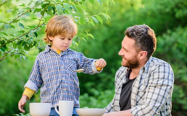Little boy and dad eat. Organic nutrition. Healthy nutrition concept. Nutrition habits. Family enjoy homemade meal. Personal example. Nutrition kids and adults. Father teach son eat natural food — Stock Photo, Image
