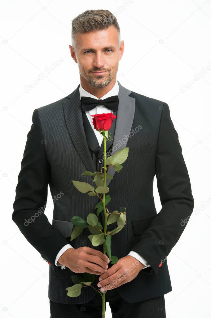 Valentines day and anniversary. Dating services. How to be romantic. Romantic gentleman. Man mature confident macho with romantic gift. Handsome guy rose flower romantic date. Perfectionist concept
