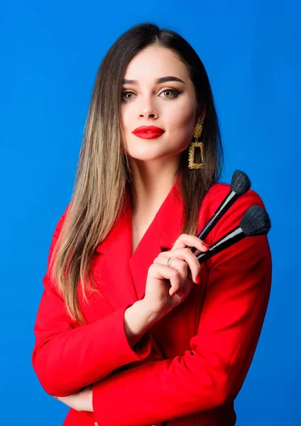 Gorgeous lady make up red lips. Attractive woman applying makeup brush. Perfect skin tone. Makeup artist concept. Looking good and feeling confident. Professional makeup supplies shop. Makeup courses