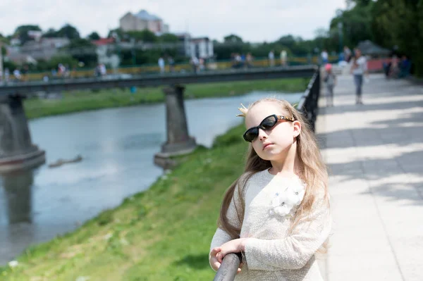 Luxurious beauty. Prom queen. Adorable prom girl on summer day. Little child with long hair wearing golden crown for junior prom. Cute small girl going to prom party