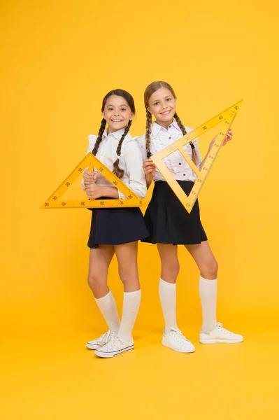 School students study geometry. Pupil school girls big rulers. School knowledge. Explore world with math. Mathematical theory combining algebraic and geometric methods. Discover mathematics patterns — Stock Photo, Image
