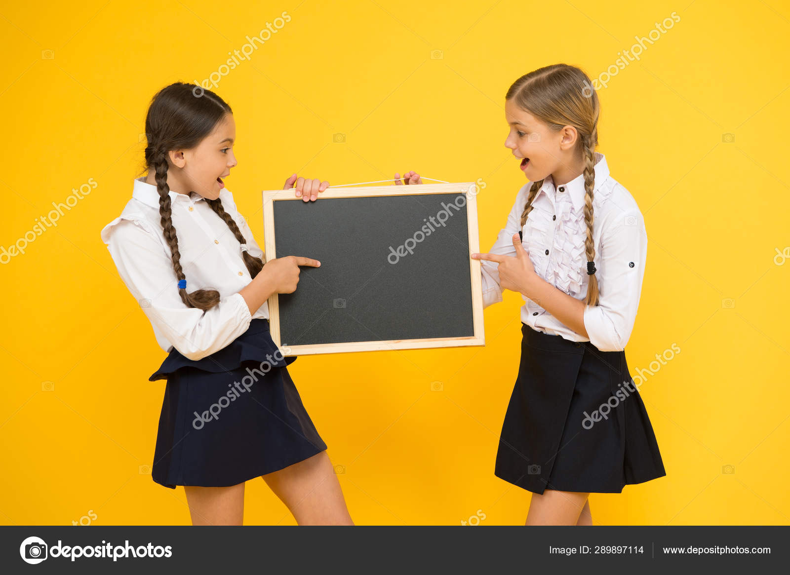 Learning fun at lesson. Cute small schoolchildren reciting lesson at ...