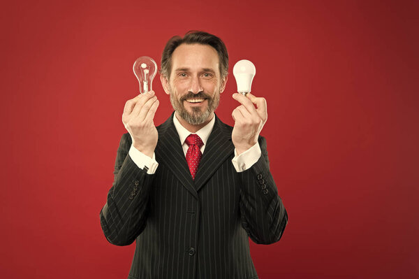 I got it. Man with beard search for inspiration. Lamp. Electricity and energy. Mature bearded man with lamp. Businessman in suit hold light bulb. Power saving. Business startup. In search of new idea