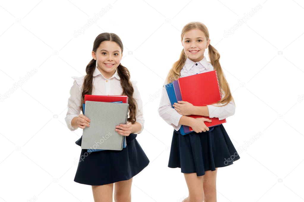 Having a mutual taste in literature. Cute literature readers. Adorable little schoolgirls holding books in English literature. Small primary school children studying foreign language and literature