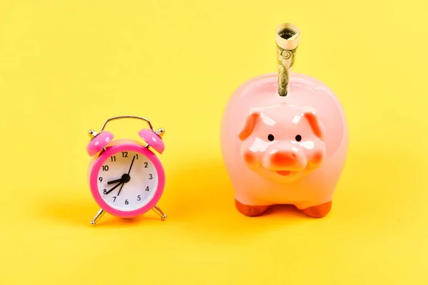 need time to get rich. budget increase policy. business startup. financial position. success in finance and commerce. piggy bank with alarm clock. Moneybox. retirement. family budget. time is money