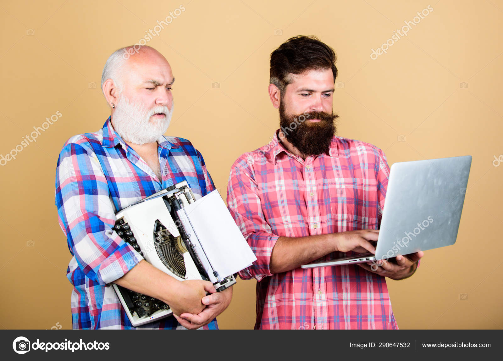 Renovation. two bearded men. Vintage typewriter. youth vs old age