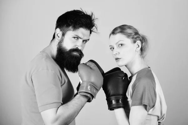 Sport for everyone. Amateur boxing club. Equal possibilities. Strength and power. Man and woman in boxing gloves. Be careful. Boxing sport concept. Couple girl and hipster practicing boxing