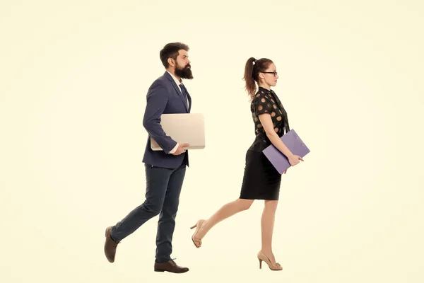 Follow same direction. Businessman bearded face and lady with documents folder. New business direction. Looking for opportunities and new chances. Man formal suit and lady walking same direction