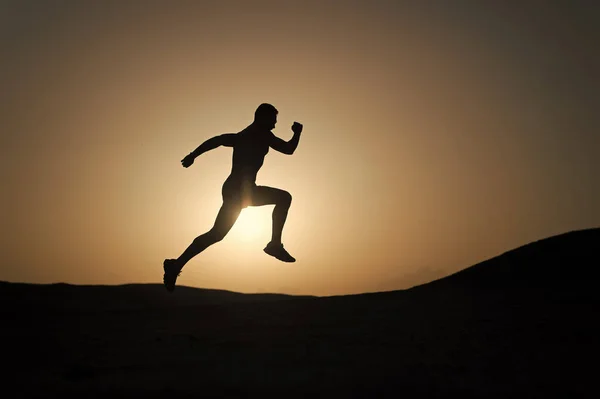 Never stop. Silhouette man motion running in front of sunset sky background. Future success depends on your efforts now. Daily motivation. Healthy lifestyle personal achievements goals and success — Stock Photo, Image