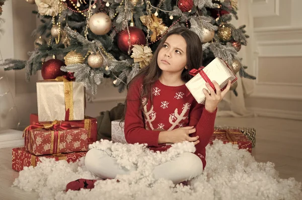 christmas family holiday. happy new year. Christmas shopping. waiting for santa. Xmas. The morning before Xmas. Cute little child girl with xmas present. what is inside