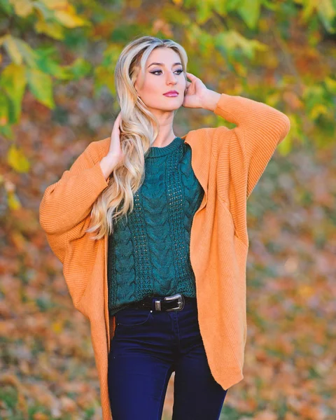 Clothing for every day. Girl adorable blonde posing in warm and cozy outfit autumn nature background defocused. Cozy casual outfits for fall. Cozy outfit ideas for weekend. Woman walk sunset light