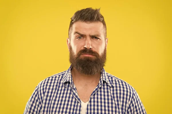 Are you serious. Man serious face raising eyebrow not confident. Have some doubts. Hipster bearded face not sure in something. Doubtful bearded man on yellw background close up. Doubtful expression — Stock Photo, Image