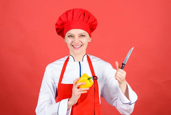 professional chef in kitchen. Cuisine. happy woman cooking healthy food by recipe. sweet pepper. Housewife with cooking knife. woman in cook hat and apron. Healthy food is healthy life