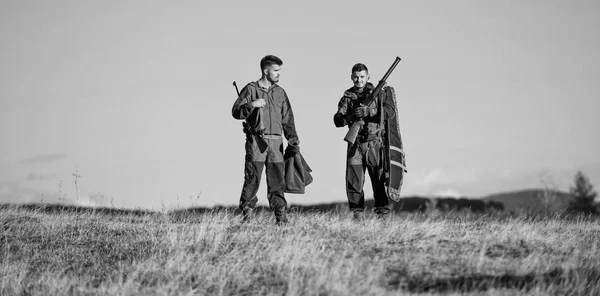 Man hunters with rifle gun. Boot camp. Hunting skills and weapon equipment. How turn hunting into hobby. Military uniform. Friendship of men hunters. Army forces. Camouflage. Masculine hobby activity — Stock Photo, Image