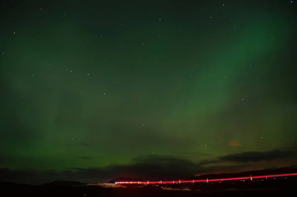 Northern lights - beauty of nature. iceland northern lights in reykjavik. polar lights or northern wand. this beautiful northern lights or aurora borealis in iceland at night. true beauty. — Stock Photo, Image