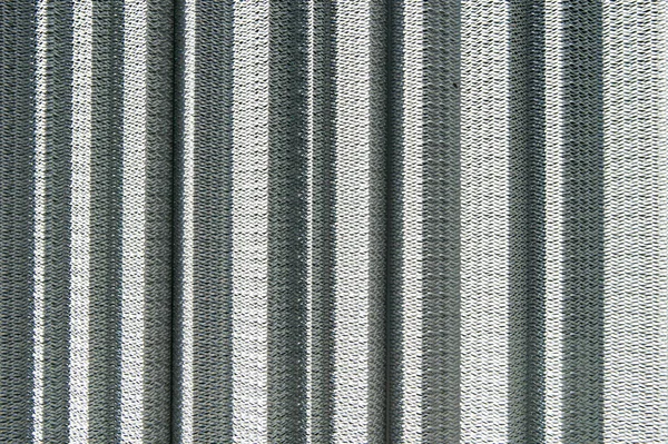 Industrial concept. Iron producing. Sharp metallic texture. Silver foil background. Metal surface lathing. Metallic netting. Protective material. Metal recycling. Metallic screen