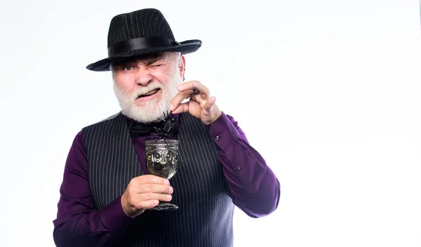 Add spider cocktail recipe. Halloween concept. Disgusting Halloween drink. Elegant bartender wear hat and vest prepare drink. Horror themed Halloween party. Weird old grandfather with gray beard — Stock Photo, Image